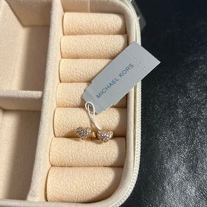 These are stud heart, rose/gold earrings, and from Micheal Kors.